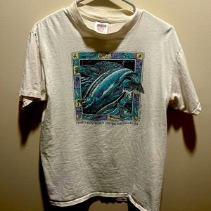 Medium white shirt with painting from 1989 on it.